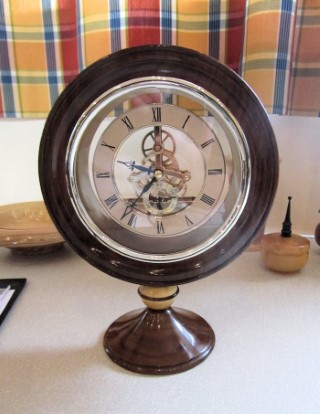 Skeleton clock in walnut stand by Howard Overton